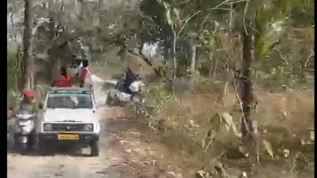 A tourist's car overturned after being hit by two rhinos in Jaldapara Sanctuary